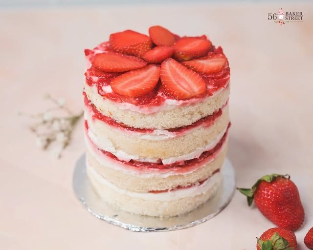 Strawberry naked cake with cream layers