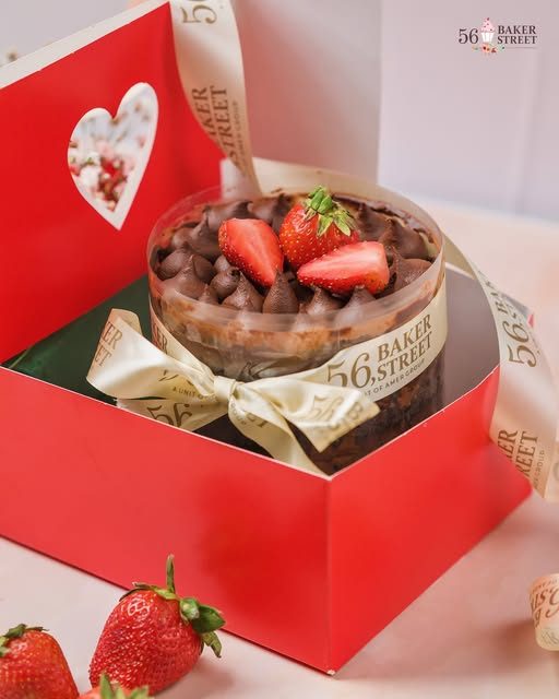 Cake in a red heart-window gift box